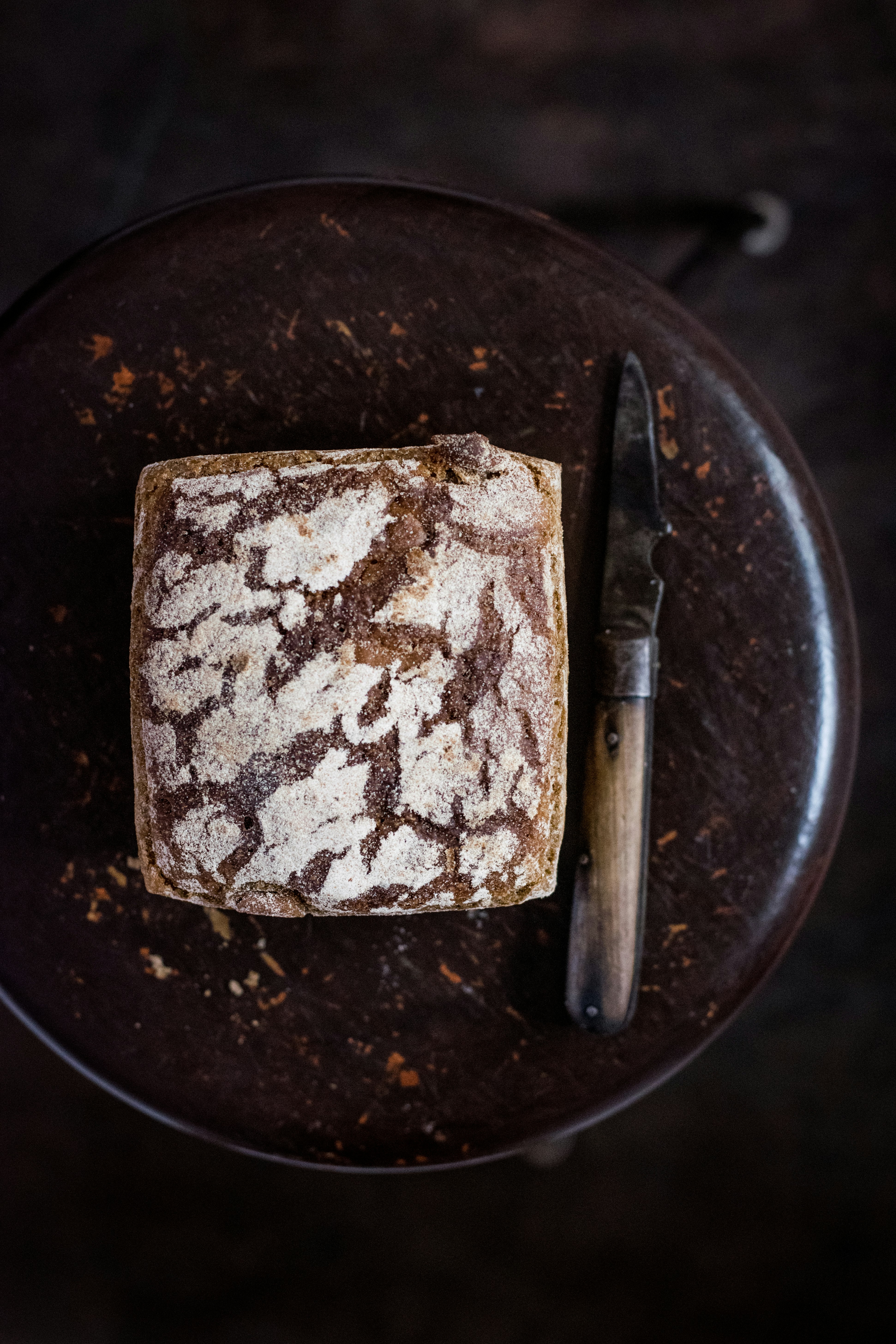 bread beside knife on chair